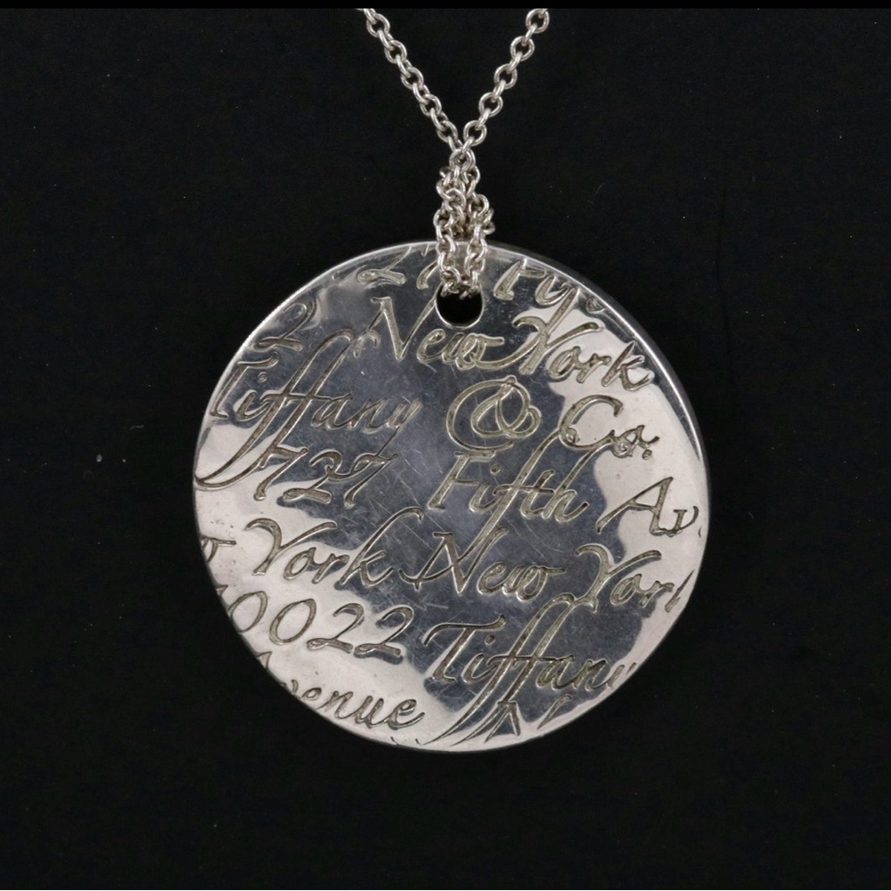 Tiffany & Co. Notes Sterling Round Disc
Pendant Necklace